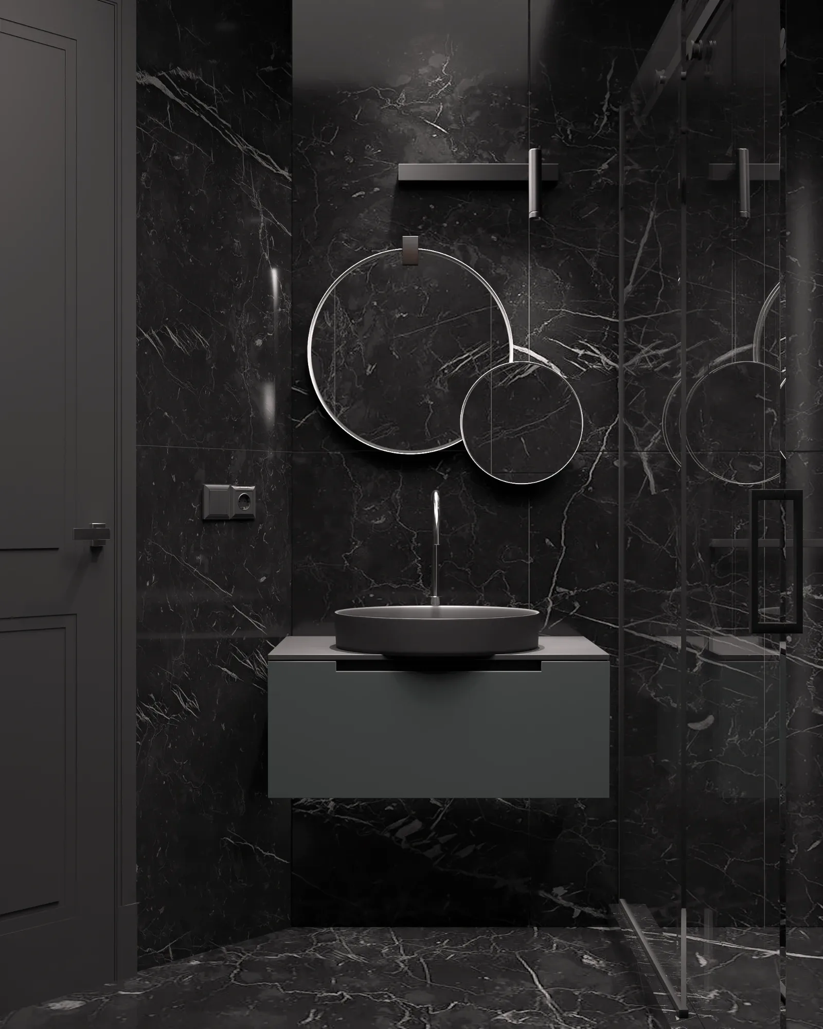 Shower room lined floor to ceiling in black marble, with two round mirrors above a wall-hung vanity and a walk-in glass shower.