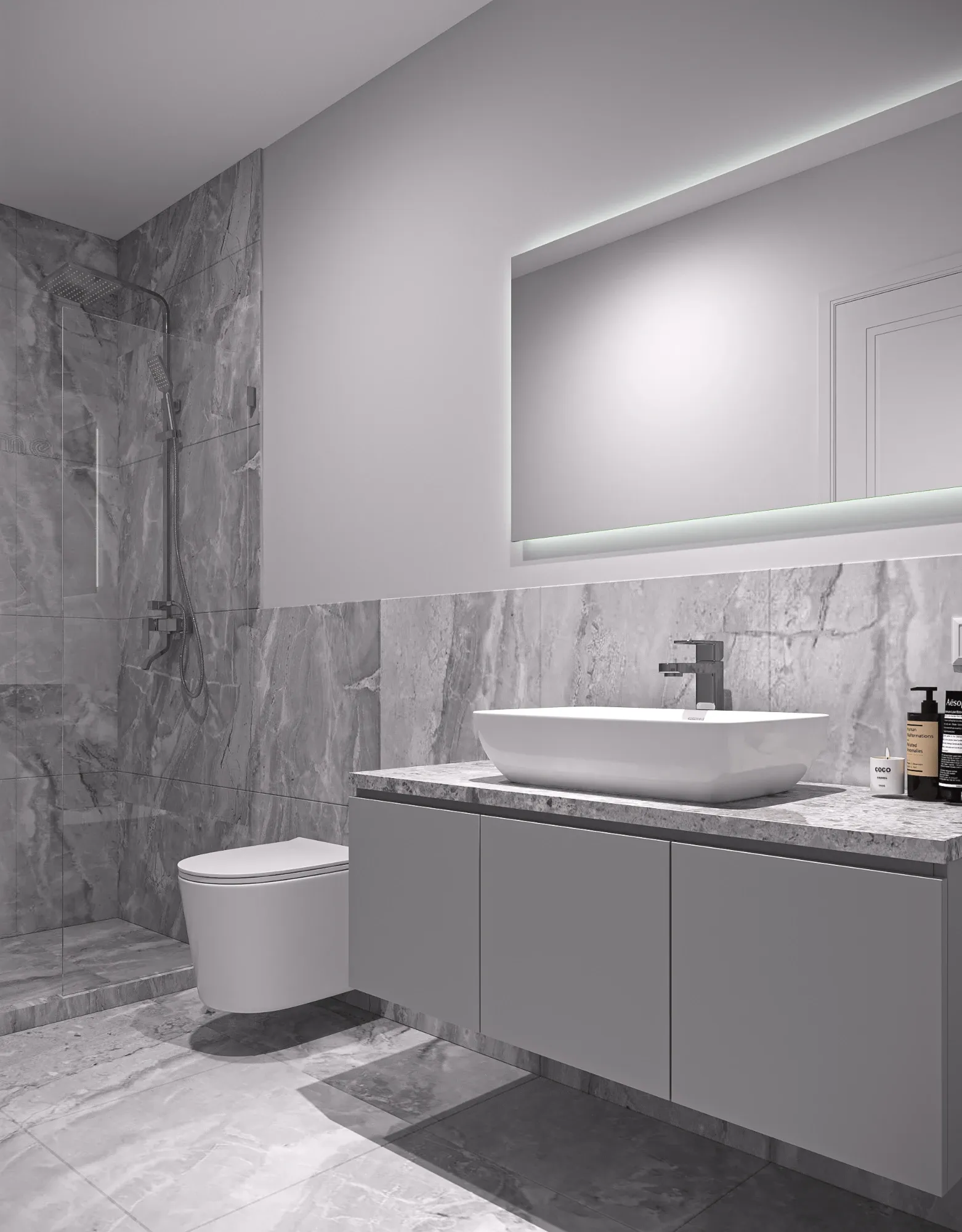 The same guest bathroom seen from the doorway, showing the walk-in shower, wall-hung WC and the full run of the stone-topped vanity.